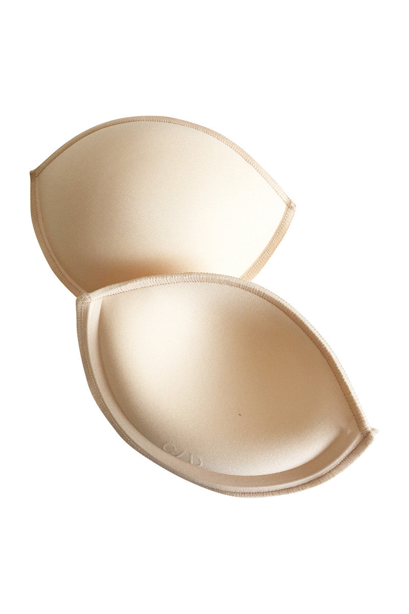 Pair of Bust Ups Breast Enhancers showing the contour that provides
the cleavage lift on a white background