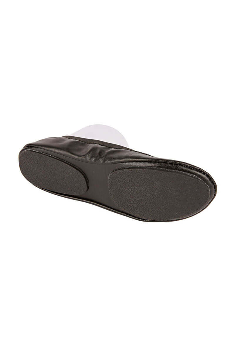 The sole of a pair of black fold up ballet flat shoes against a white background.