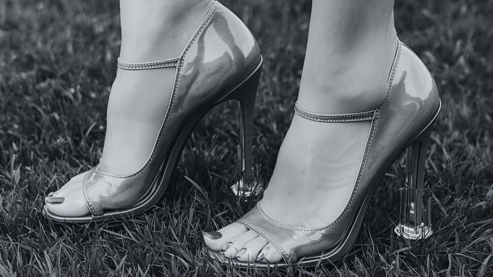 Silver high-heeled shoes on grass with high heel protectors from secret weapons, makes you comfortable to walk in every step especially in a grass surface