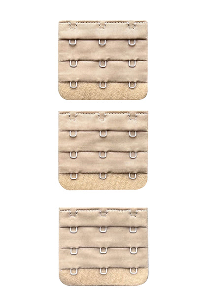 A set of 3 x 3 hook nude/beige skin tone colour bra strap extenders ona white background