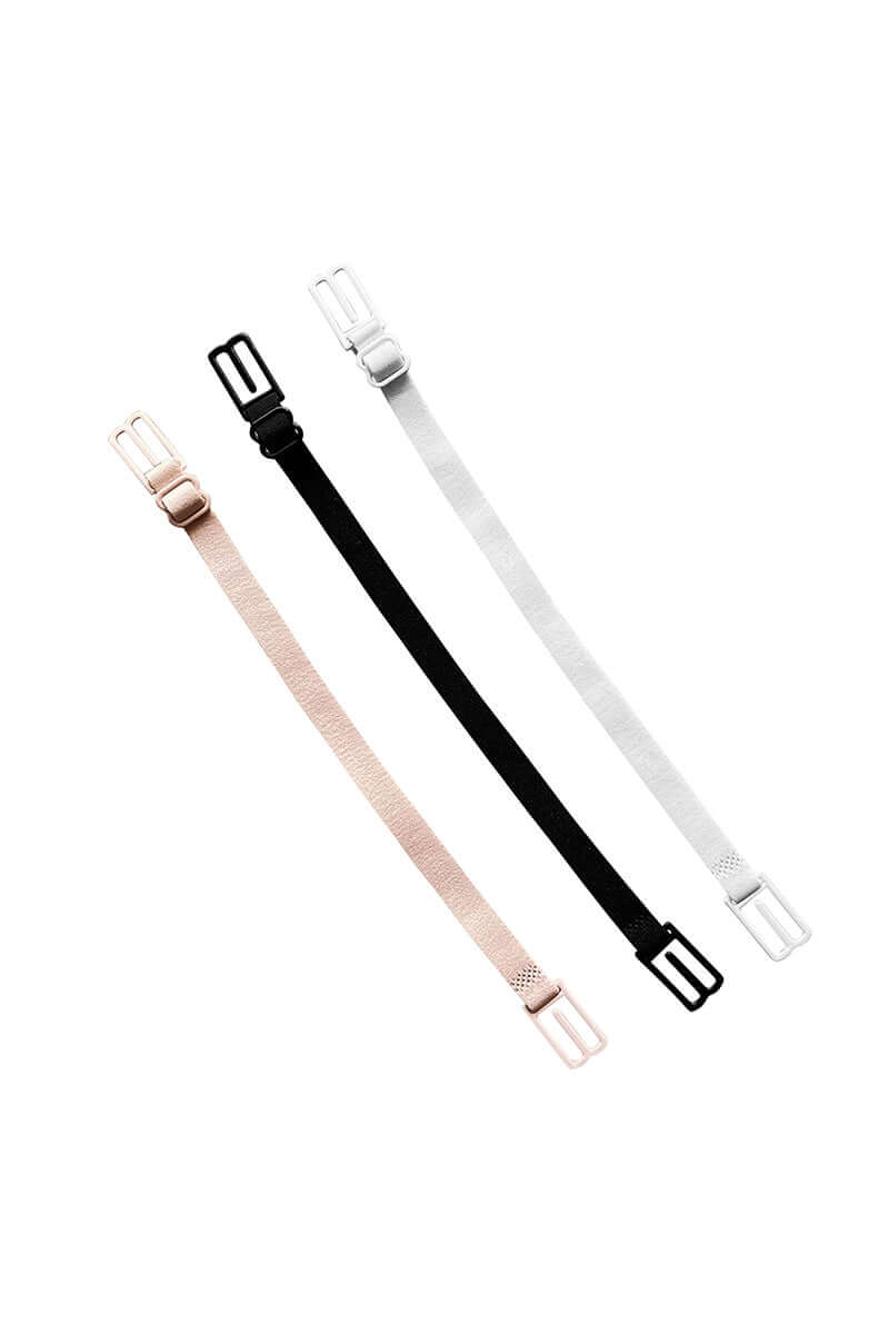 Three adjustable bra straps in beige, black, and white are aligned diagonally on a plain white background, showcasing their buckle designs at each end.