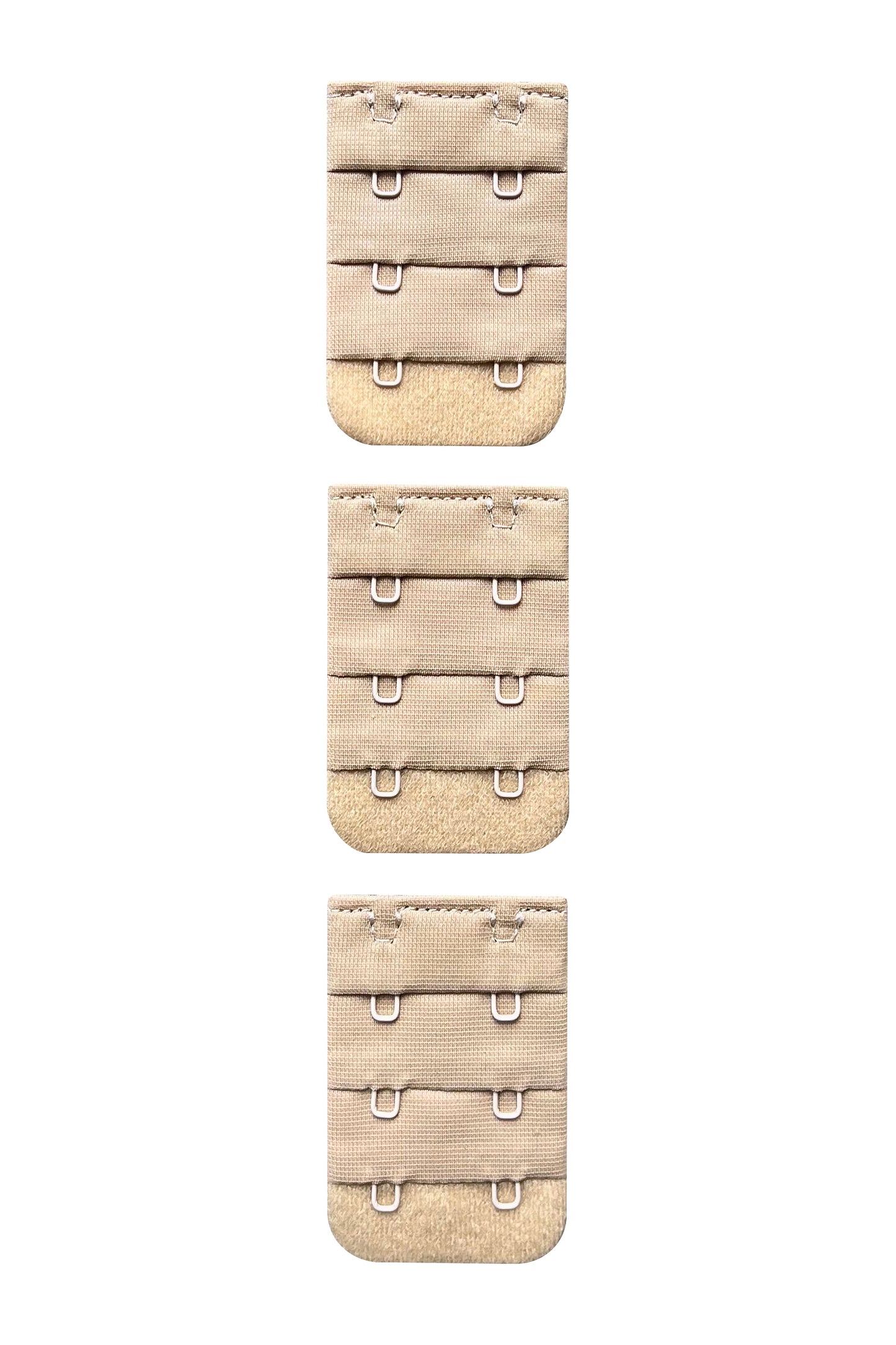 A set of three 2 hook nude/beige skin tone colour bra strap extenders ona white background