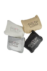 Black, silver, white and gold colour fold up ballet flat shoes in a carry purse against a white background. 