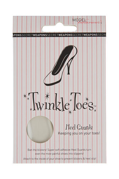 Package of "Twinkle Toes" heel guards featuring a high-heel illustration, set against a pink-striped background. Text reads: "Keeping you on your toes! Ban the blisters! Super soft adhesive Heel Guards turn even the most painful shoes into slippers! Attach to the inside of your shoe to prevent blisters & heel slip!"
