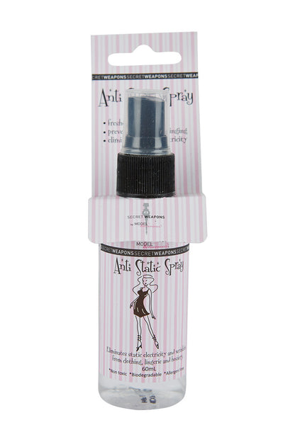 Spray bottle labeled "Anti Static Spray" eliminates static and wrinkles in clothing. Text: "Secret Weapons by MODELinterational," "freshens, prevents clinging, eliminates static electricity," "60mL," "Non-toxic," "Biodegradable," "Allergen Free." Pink striped packaging.
