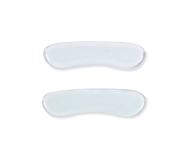 Two translucent, curved gel patches are positioned parallel to each other against a plain white background.