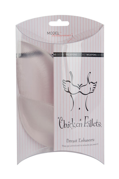 Breast enhancers packaged in a clear, striped box with text: "MODEL behaviour" and "Secret Weapons." Illustration depicts a bust with wings. Text reads: "Chicken Fillets Breast Enhancers. They go unnoticed to ensure you won't!"