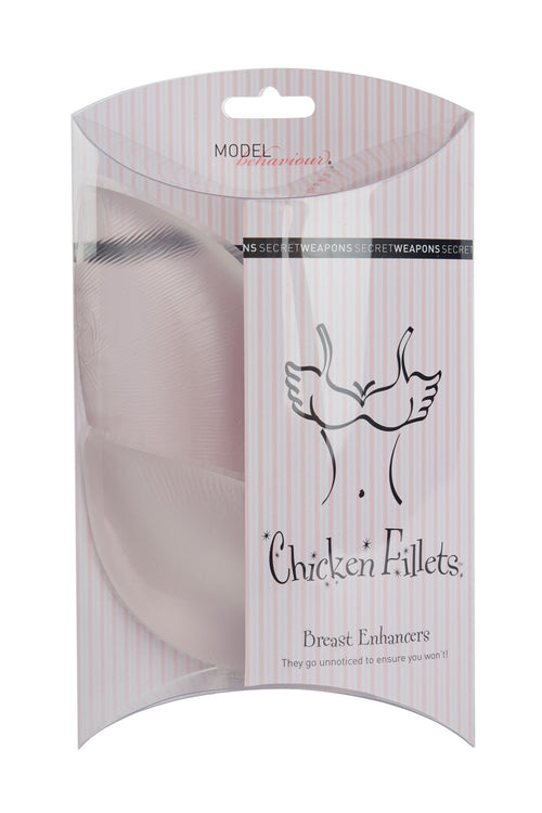 Breast enhancers packaged in a clear, striped box with text: "MODEL behaviour" and "Secret Weapons." Illustration depicts a bust with wings. Text reads: "Chicken Fillets Breast Enhancers. They go unnoticed to ensure you won't!"